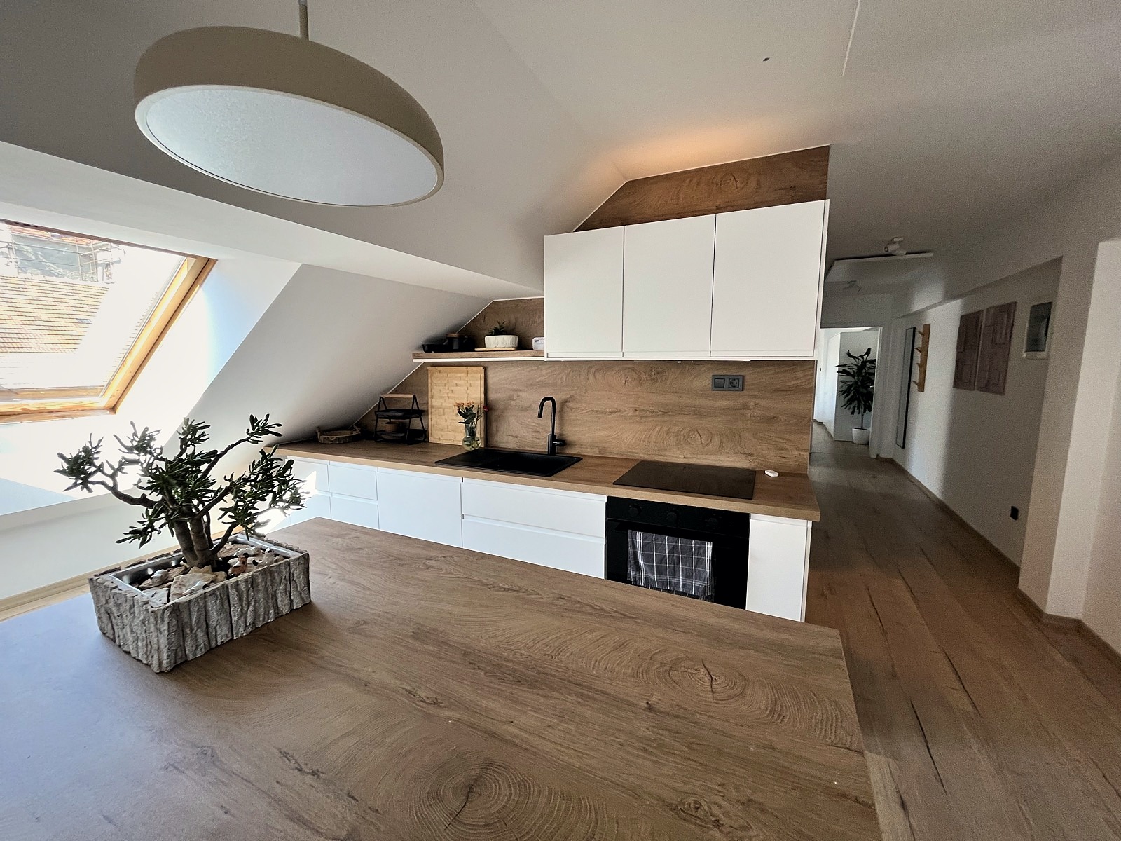 Kitchen island and worktop beneath the dormer skylight